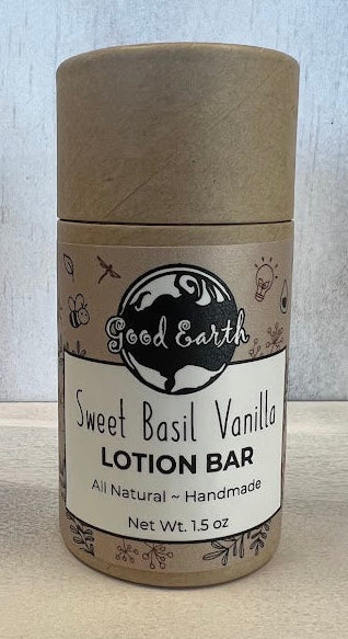Sweet Basil Vanilla lotion bar in an eco-friendly cylindrical container.
